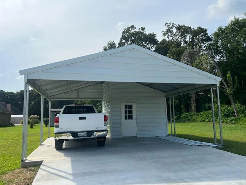 Metal carport and enclosed storage combo with a pickup parked under the roof