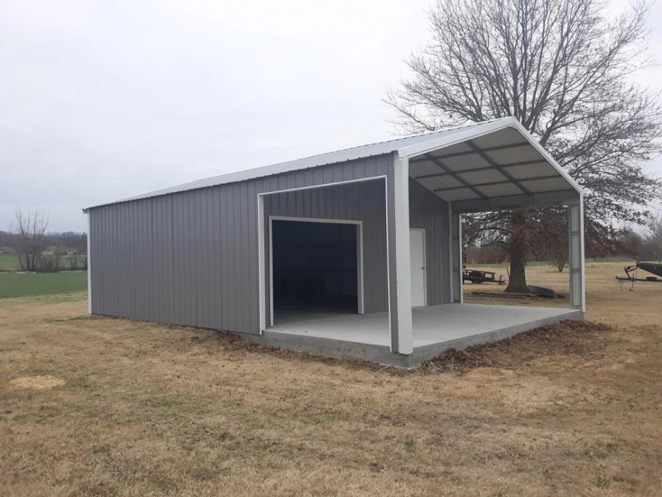 Gray metal garage with an enclosed workshop and an open covered bay